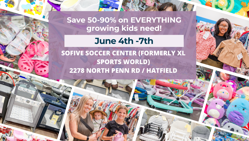 Two ladies smile as the hold up hangers with clothing on them. They are both standing next to a rack full of clothing for sale.